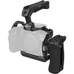 Handheld camera rig with a top handle and side grip mounted on a mirrorless camera for stabilized shooting.